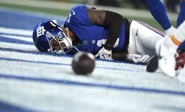 New York Giants wide receiver Malik Nabers (1) is slow to get up after being injured during the second half of an NFL football game against the Kansas City Chiefs Sunday, Sept. 21, 2025, in East Rutherford, N.J. (AP Photo/Seth Wenig)