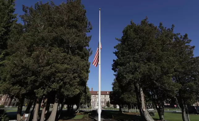 FILE - The main flag pole in front of the U.S. Army I Corps headquarters on Joint Base Lewis-McChord, south of Tacoma, Wash., hangs at half-staff, Wednesday, Dec. 5, 2018. (AP Photo/Ted S. Warren, File)