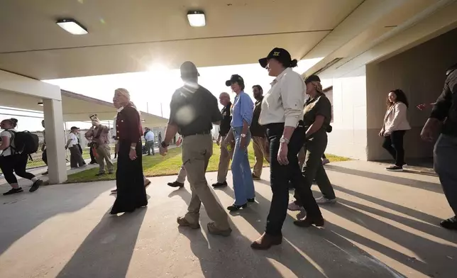 Homeland Security Secretary Kristi Noem, center, tours "Camp 57," a facility to house immigration detainees at the Louisiana State Penitentiary in Angola, La., with Louisiana Gov. Jeff Landry and Attorney General Pam Bondi, and ICE Deputy Director Madison Sheahan, Wednesday, Sept. 3, 2025. (AP Photo/Gerald Herbert, Pool)