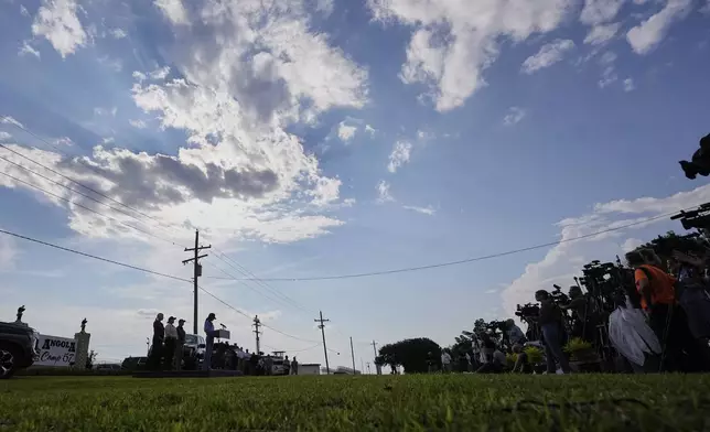 Homeland Security Secretary Kristi Noem, left, speaks to reporters before touring "Camp 57," a facility to house immigration detainees at the Louisiana State Penitentiary in Angola, La., with Louisiana Gov. Jeff Landry and Attorney General Pam Bondi, and ICE Deputy Director Madison Sheahan, Wednesday, Sept. 3, 2025. (AP Photo/Gerald Herbert)