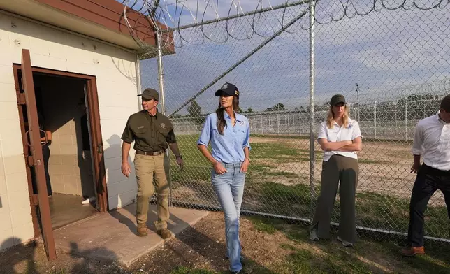 Homeland Security Secretary Kristi Noem tours "Camp 57," a facility to house immigration detainees at the Louisiana State Penitentiary in Angola, La., Wednesday, with Louisiana Gov. Jeff Landry, left, Sept. 3, 2025. (AP Photo/Gerald Herbert, Pool)