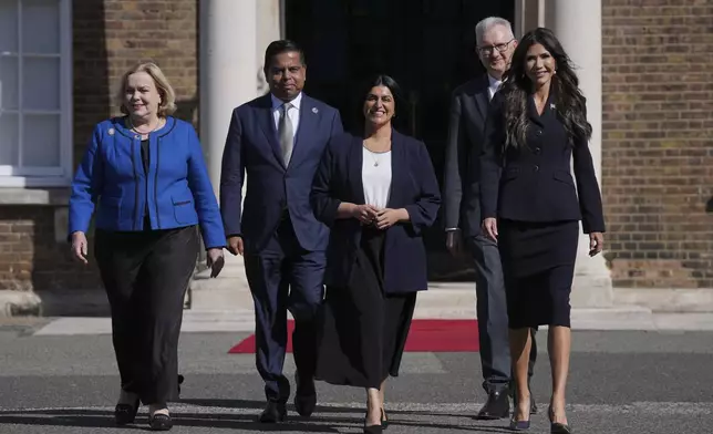 From left, New Zealand's Minister Judith Collins, Canada Minister of Public Safety Gary Anandasangaree, Britain's Home Secretary Shabana Mahmood, Australia Minister for Home Affairs Tony Burke and United States Homeland Security Secretary Kristi Noem arrive for a family photo during the Five Country Ministerial meeting at the Honourable Artillery Company in London, Monday, Sept. 8, 2025 as interior ministers of the UK, US, Canada, Australia and New Zealand will discuss some of the major security threats facing our nations. (AP Photo/Kin Cheung)