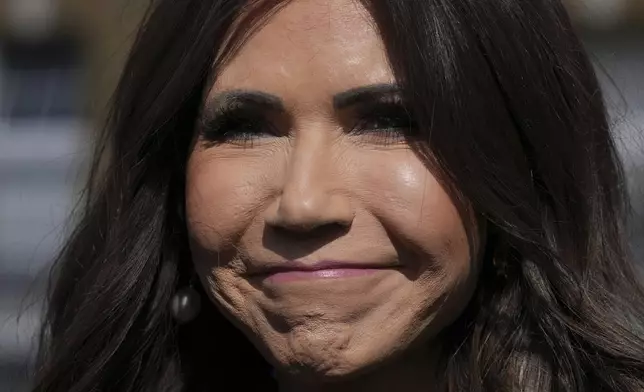 United States Homeland Security Secretary Kristi Noem speaks to media during the Five Country Ministerial meeting at the Honourable Artillery Company in London, Monday, Sept. 8, 2025 as interior ministers of the UK, US, Canada, Australia and New Zealand will discuss some of the major security threats facing their nations. (AP Photo/Kin Cheung)