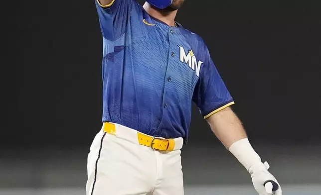 Minnesota Twins' Kody Clemens (18) celebrates his RBI-double against the Arizona Diamondbacks in the sixth inning of a baseball game, Friday, Sept. 12, 2025, in Minneapolis. (AP Photo/Mike Stewart)
