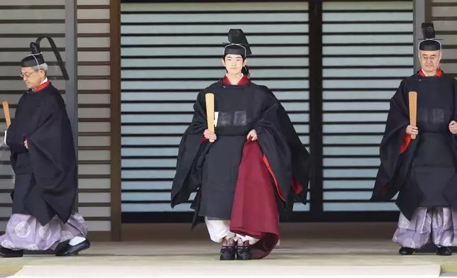 Japanese Prince Hisahito, son of Crown Prince Akishino, wearing ancient ceremonial costume, leaves for a ceremony by a carriage at the Imperial Palace in Tokyo Saturday, Sept. 6, 2025 as he celebrated his 19th birthday and attended the coming-of-age ceremony at the palace. (Yoshikazu Tsuno/Pool Photo via AP)