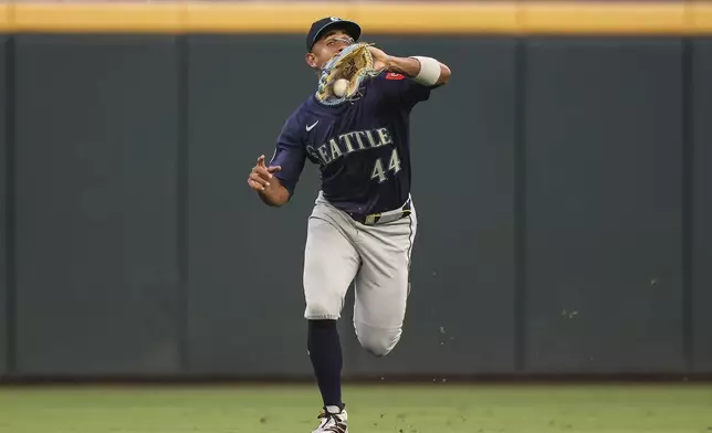 Seattle Mariners outfielder Julio Rodríguez makes a catch in the second inning of a baseball game against the Atlanta Braves, Friday, Sept. 5, 2025, in Atlanta. (AP Photo/Colin Hubbard)