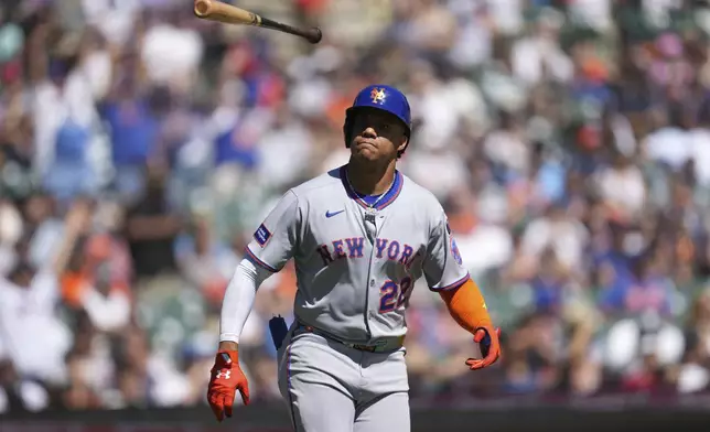 New York Mets' Juan Soto flips his bat after hitting a grand slam against the Detroit Tigers in the fourth inning during a baseball game Monday, Sept. 1, 2025, in Detroit. (AP Photo/Paul Sancya)