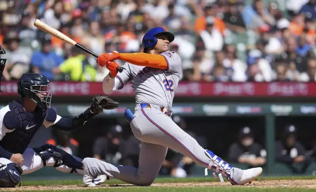 New York Mets outfielder Juan Soto hits a grand slam against the Detroit Tigers in the fourth inning during a baseball game Monday, Sept. 1, 2025, in Detroit. (AP Photo/Paul Sancya)