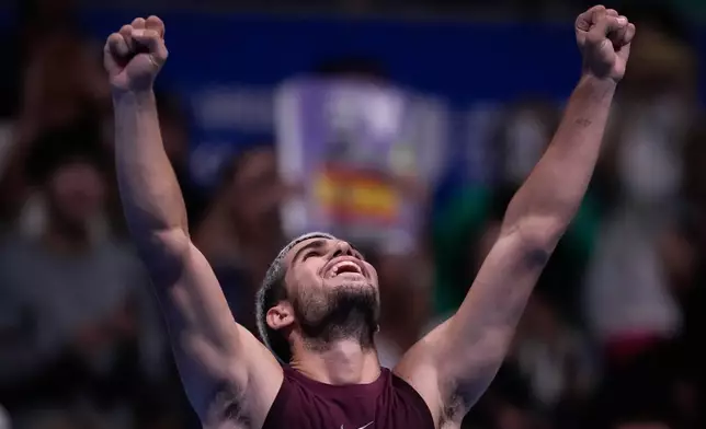 Spain's Carlos Alcaraz, reacts after defeating United States' Taylor Fritz during the men's final match at the Tokyo ATP 500 tennis tournament at Ariake Coliseum, in Tokyo, Japan, Tuesday, Sept. 30, 2025. (AP Photo/Louise Delmotte)