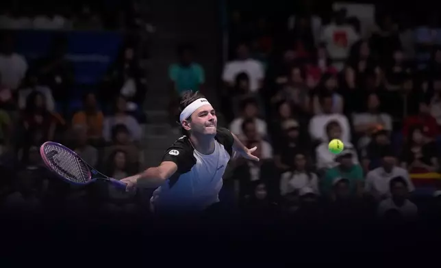 United States' Taylor Fritz plays a shot against Spain's Carlos Alcaraz during the men's final match at the Tokyo ATP 500 tennis tournament at Ariake Coliseum, in Tokyo, Japan, Tuesday, Sept. 30, 2025. (AP Photo/Louise Delmotte)