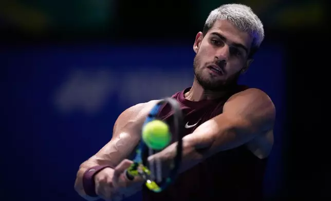 Spain's Carlos Alcaraz, plays a shot against United States' Taylor Fritz during the men's final match at the Tokyo ATP 500 tennis tournament at Ariake Coliseum, in Tokyo, Japan, Tuesday, Sept. 30, 2025. (AP Photo/Louise Delmotte)