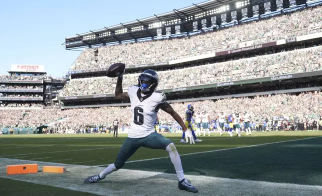 Philadelphia Eagles wide receiver DeVonta Smith celebrates after scoring during the second half of an NFL football game against the Los Angeles Rams Sunday, Sept. 21, 2025, in Philadelphia. (AP Photo/Matt Slocum)