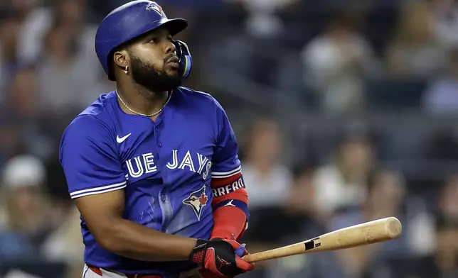 Toronto Blue Jays' Vladimir Guerrero Jr. watches his home run during the fifth inning of a baseball game against the New York Yankees, Friday, Sept. 5, 2025, in New York. (AP Photo/Adam Hunger)