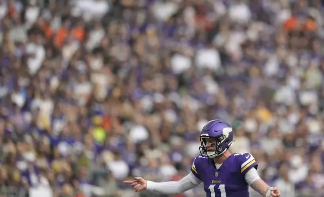 Minnesota Vikings quarterback Carson Wentz calls a play during the second half of an NFL football game against the Cincinnati Bengals, Sunday, Sept. 21, 2025, in Minneapolis. (AP Photo/Mike Stewart)