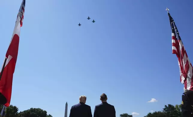 President Donald Trump and Polish President Karol Nawrocki watch a military aircraft flyover at the White House, Wednesday, Sept. 3, 2025, in Washington. The Washington Monument stands in the distance. (AP Photo/Evan Vucci)