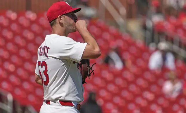St. Louis Cardinals starting pitcher Andre Pallante blows on his hand after giving up a three-run home run to Cincinnati Reds' Spencer Steer during the fourth inning of a baseball game Wednesday, Sept. 17, 2025, in St. Louis. (AP Photo/Jeff Roberson)