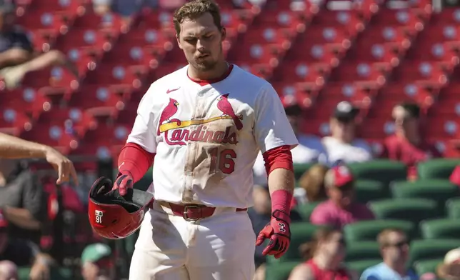 St. Louis Cardinals' Nolan Gorman removes his helmet after striking out to end the sixth inning of a baseball game against the Cincinnati Reds Wednesday, Sept. 17, 2025, in St. Louis. (AP Photo/Jeff Roberson)