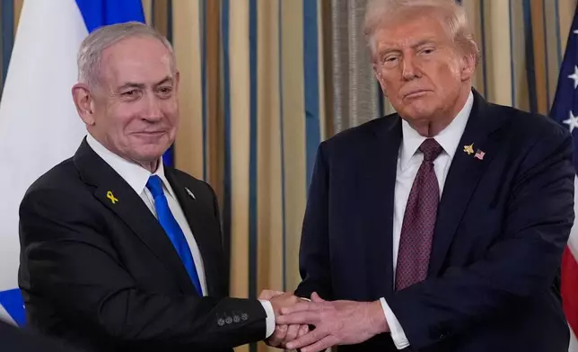 Israel's Prime Minister Benjamin Netanyahu shakes hands with President Donald Trump after a news conference in the State Dining Room of the White House, Monday, Sept. 29, 2025, in Washington. (AP Photo/Alex Brandon)
