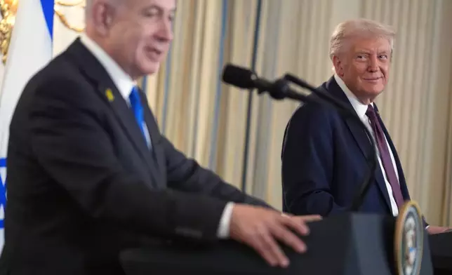 President Donald Trump listens during a news conference with Israeli Prime Minister Benjamin Netanyahu in the State Dining Room of the White House, Monday, Sept. 29, 2025, in Washington. (AP Photo/Evan Vucci)
