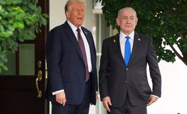 President Donald Trump, left, greets Israeli Prime Minister Benjamin Netanyahu at the White House, Monday, Sept. 29, 2025, in Washington. (AP Photo/Evan Vucci)
