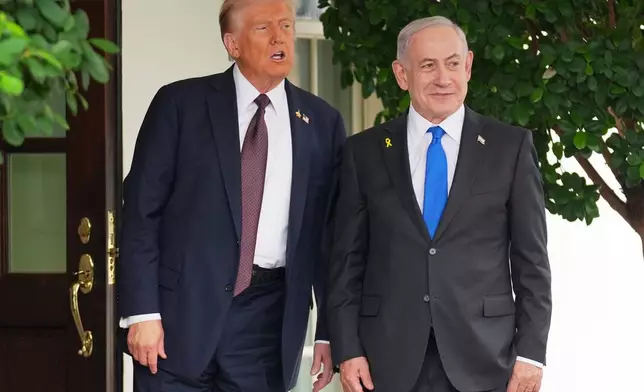 President Donald Trump, left, greets Israeli Prime Minister Benjamin Netanyahu at the White House, Monday, Sept. 29, 2025, in Washington. (AP Photo/Evan Vucci)