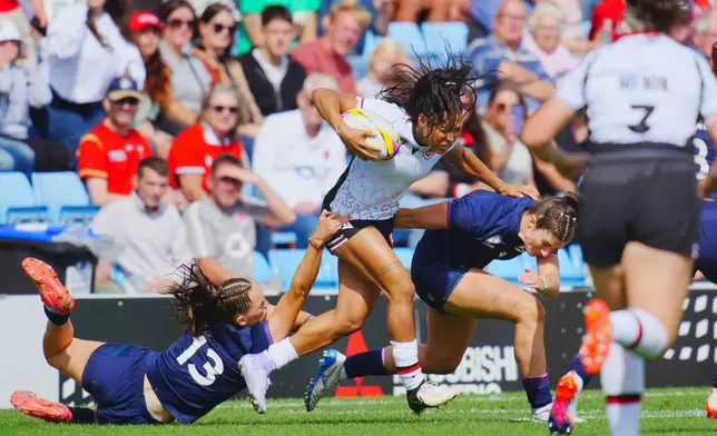 Canada's Asia Hogan-Rochester, center, in action during the Women's Rugby World Cup 2025 Pool B match between Scotland and Canada, at Sandy Park, in Exeter, England, Saturday, Sept. 6, 2025. (Ben Birchall/PA via AP)