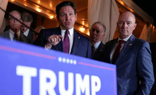 FILE - Florida Gov. Ron DeSantis speaks at a meeting with Republican governors and President-elect Donald Trump, at Mar-a-Lago, in Palm Beach, Fla., Jan. 9, 2025. (AP Photo/Evan Vucci, File)