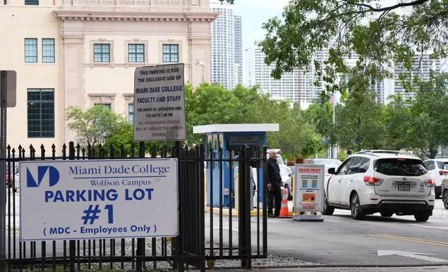 Republican Florida Gov. Ron DeSantis is proposing that President Donald Trump's presidential library be built in a parking lot that is currently used by Miami-Dade College staff and faculty and is adjacent to the Freedom Tower, Tuesday, Sept. 23, 2025, in Miami. (AP Photo/Marta Lavandier)
