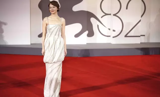 Emma Stone poses for photographers on the red carpet for the film 'Bugonia' during the 82nd edition of the Venice Film Festival in Venice, Italy, on Thursday, Aug. 28, 2025. (Photo by Alessandra Tarantino/Invision/AP)