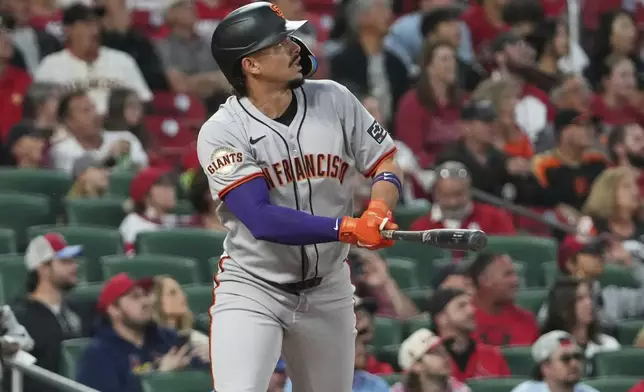 San Francisco Giants' Willy Adames watches his solo home run during the first inning of a baseball game against the St. Louis Cardinals Friday, Sept. 5, 2025, in St. Louis. (AP Photo/Jeff Roberson)