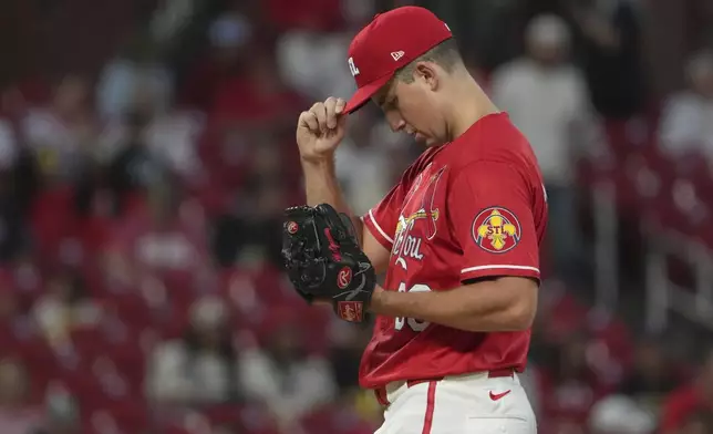 St. Louis Cardinals starting pitcher Michael McGreevy adjusts his cap after giving up a solo home run to San Francisco Giants' Rafael Devers during the first inning of a baseball game Friday, Sept. 5, 2025, in St. Louis. (AP Photo/Jeff Roberson)