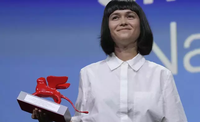 Director Nastia Korkia accepts the Lion of the future award for best debut film for 'Short Summer' during the awards ceremony of the 82nd edition of the Venice Film Festival in Venice, Italy, on Saturday, Sept. 6, 2025. (Photo by Alessandra Tarantino/Invision/AP)