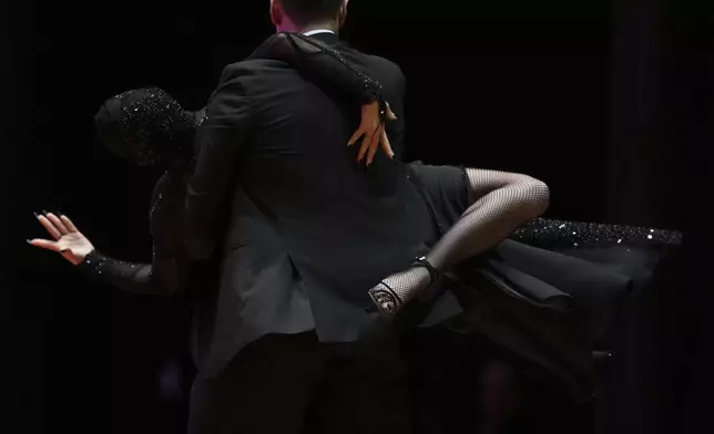 Leandro Bojko and Micaela Garcia compete in the stage category finals of the World Tango Championship, in Buenos Aires, Argentina, Tuesday, Sept. 2, 2025. (AP Photo/Natacha Pisarenko)