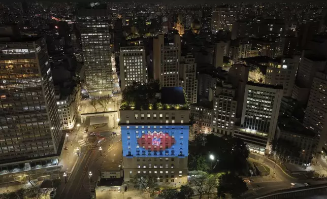 An image of a football is projected onto the city hall building in downtown São Paulo to promote the NFL season opener between the Los Angeles Chargers and the Kansas City Chiefs, Wednesday, Sept. 3, 2025. (AP Photo/Andre Penner)