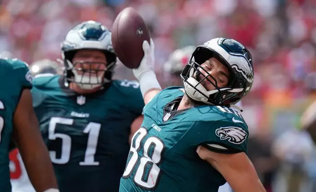 Philadelphia Eagles tight end Dallas Goedert (88) reacts after a touchdown during the first half of an NFL football game against the Tampa Bay Buccaneers, Sunday, Sept. 28, 2025, in Tampa, Fla. (AP Photo/Chris O'Meara)