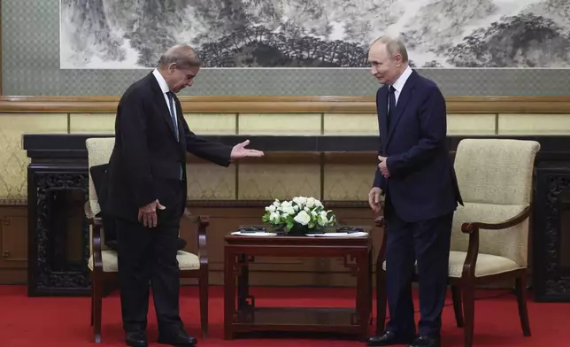 Russian President Vladimir Putin, right, meets with Pakistan's Prime Minister Shehbaz Sharif at Diaoyutai State Guesthouse in Beijing, China, Tuesday, Sept 2, 2025. (Maxim Shemetov/Pool Photo via AP)