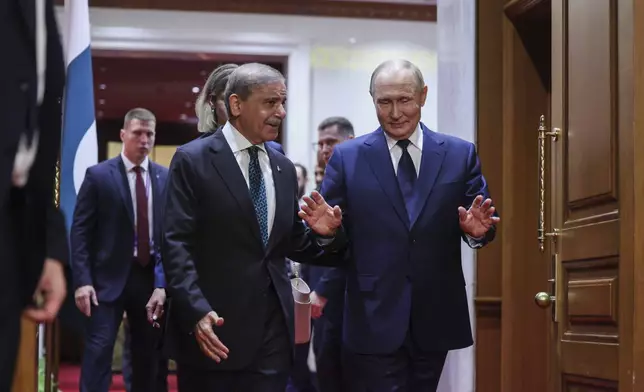 Russian President Vladimir Putin, right, meets with Pakistan's Prime Minister Shehbaz Sharif at Diaoyutai State Guesthouse in Beijing, China, Tuesday, Sept 2, 2025. (Maxim Shemetov/Pool Photo via AP)