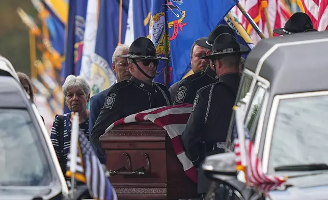 Pall bearers carry the coffin of a slain officer at the conclusion of funeral services for Northern York County Regional Police detectives Cody Michael Becker, Mark Edward Baker and Isaiah Emenheiser, Thursday, Sept. 25, 2025, in Red Lion, Pa. (AP Photo/Matt Rourke)
