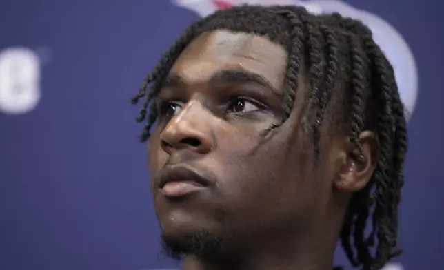 Tennessee Titans quarterback Cam Ward speaks during a news conference after an NFL football game between the Atlanta Falcons and the Tennessee Titans, Friday, Aug. 15, 2025, in Atlanta. (AP Photo/Brynn Anderson)