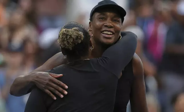 Taylor Townsend, of the United States, hugs Venus Williams, of the United States, after their quarterfinal doubles match of the U.S. Open tennis championships, Tuesday, Sept. 2, 2025, in New York. (AP Photo/Heather Khalifa)