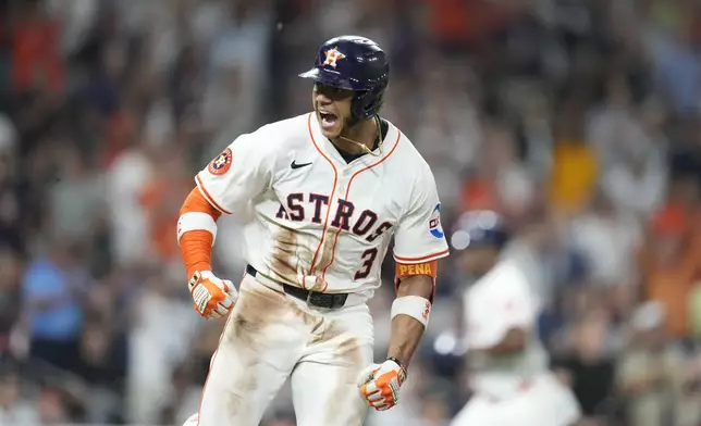 Houston Astros' Jeremy Peña (3) reacts after his RBI single against New York Yankees relief pitcher Camilo Doval during the eighth inning of a baseball game Wednesday, Sept. 3, 2025, in Houston. (AP Photo/Karen Warren)