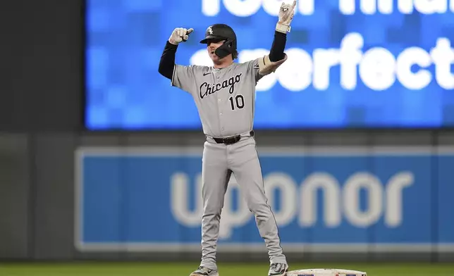 Chicago White Sox's Chase Meidroth (10) gestures after hitting a double during the fourth inning of a baseball game against the Minnesota Twins Thursday, Sept. 4, 2025, in Minneapolis. (AP Photo/Abbie Parr)