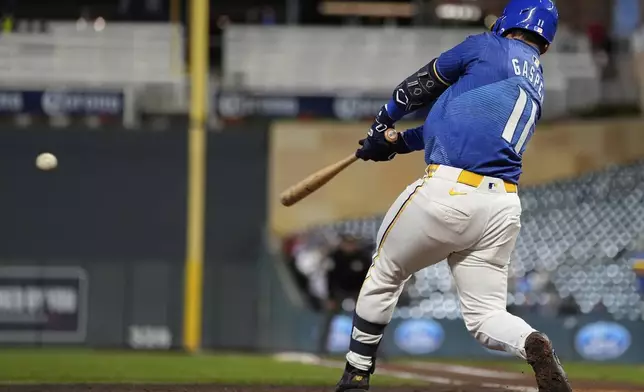 Minnesota Twins' Mickey Gasper hits a two-run single during the fourth inning of a baseball game against the Chicago White Sox, Thursday, Sept. 4, 2025, in Minneapolis. (AP Photo/Abbie Parr)