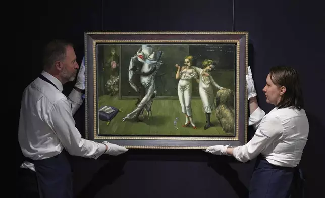 A painting by Dorothea Tanning called Interior with Sudden Joy is displayed at Sotheby's auction rooms, the painting estimated at 2-3 million US dollars is part of a collection of surrealist masterpieces unveiled in London ahead of their sale in New York, Friday, Sept. 19, 2025. (AP Photo/Kirsty Wigglesworth)