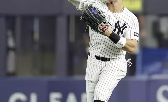 New York Yankees outfielder Aaron Judge throws in a ball hit by Toronto Blue Jays' Nathan Lukes during the first inning of a baseball game Friday, Sept. 5, 2025, in New York. (AP Photo/Adam Hunger)