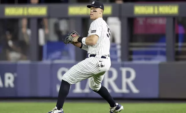 New York Yankees outfielder Aaron Judge fields a ball hit by Toronto Blue Jays' Nathan Lukes during the first inning of a baseball game Friday, Sept. 5, 2025, in New York. (AP Photo/Adam Hunger)