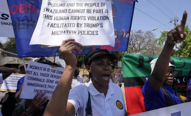 Members of Eswatin Pro-democracy activists, hold placards during their protest outside the U.S. Embassy in Pretoria, South Africa, Friday, Sept. 19, 2025. (AP Photo/Themba Hadebe)