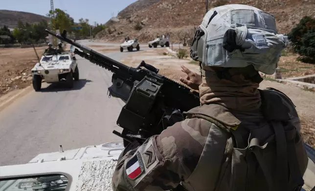 French U.N. peacekeepers patrol at the Suluki Valley, south Lebanon, Wednesday, Aug. 20, 2025. (AP Photo/Hussein Malla)