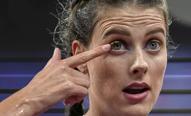 Ukraine's Yaroslava Mahuchikh gestures in the women's high jump final at the World Athletics Championships in Tokyo, Sunday, Sept. 21, 2025. (AP Photo/Louise Delmotte)