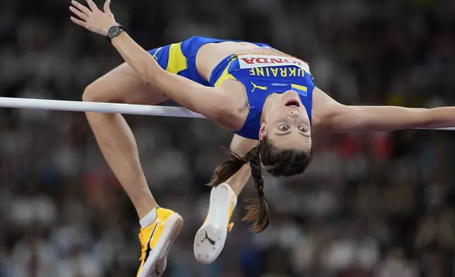 Ukraine's Yaroslava Mahuchikh competes in the women's high jump final at the World Athletics Championships in Tokyo, Sunday, Sept. 21, 2025. (AP Photo/Ashley Landis)